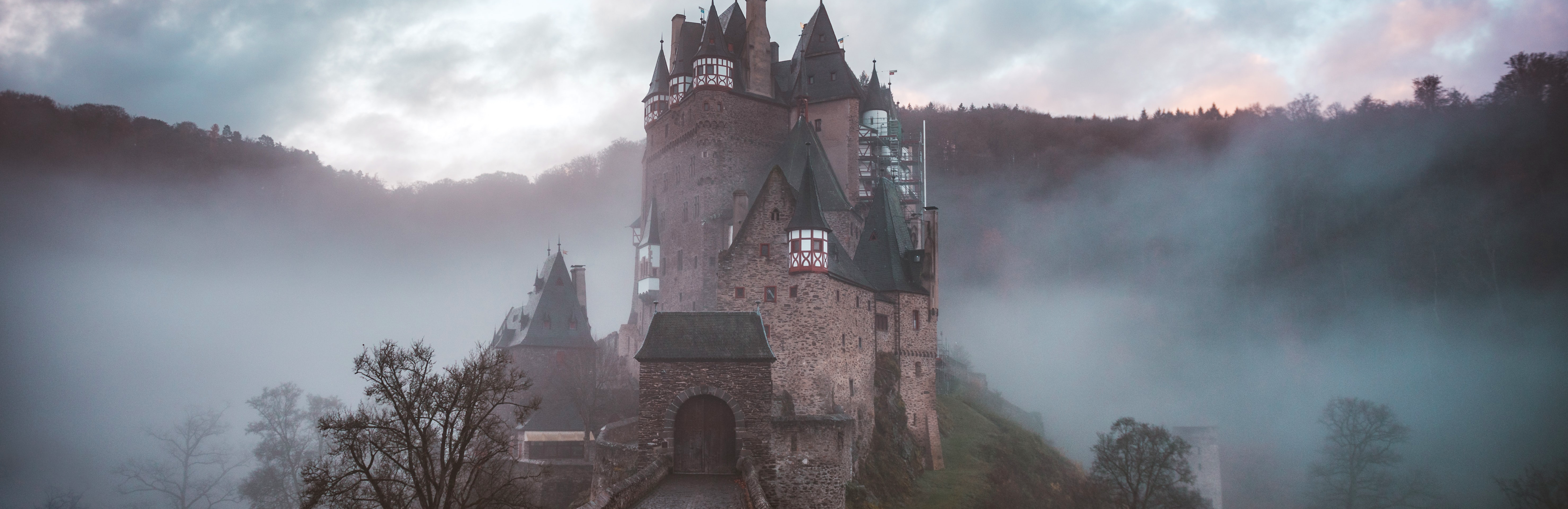 Photo of a castle surrounded by fog